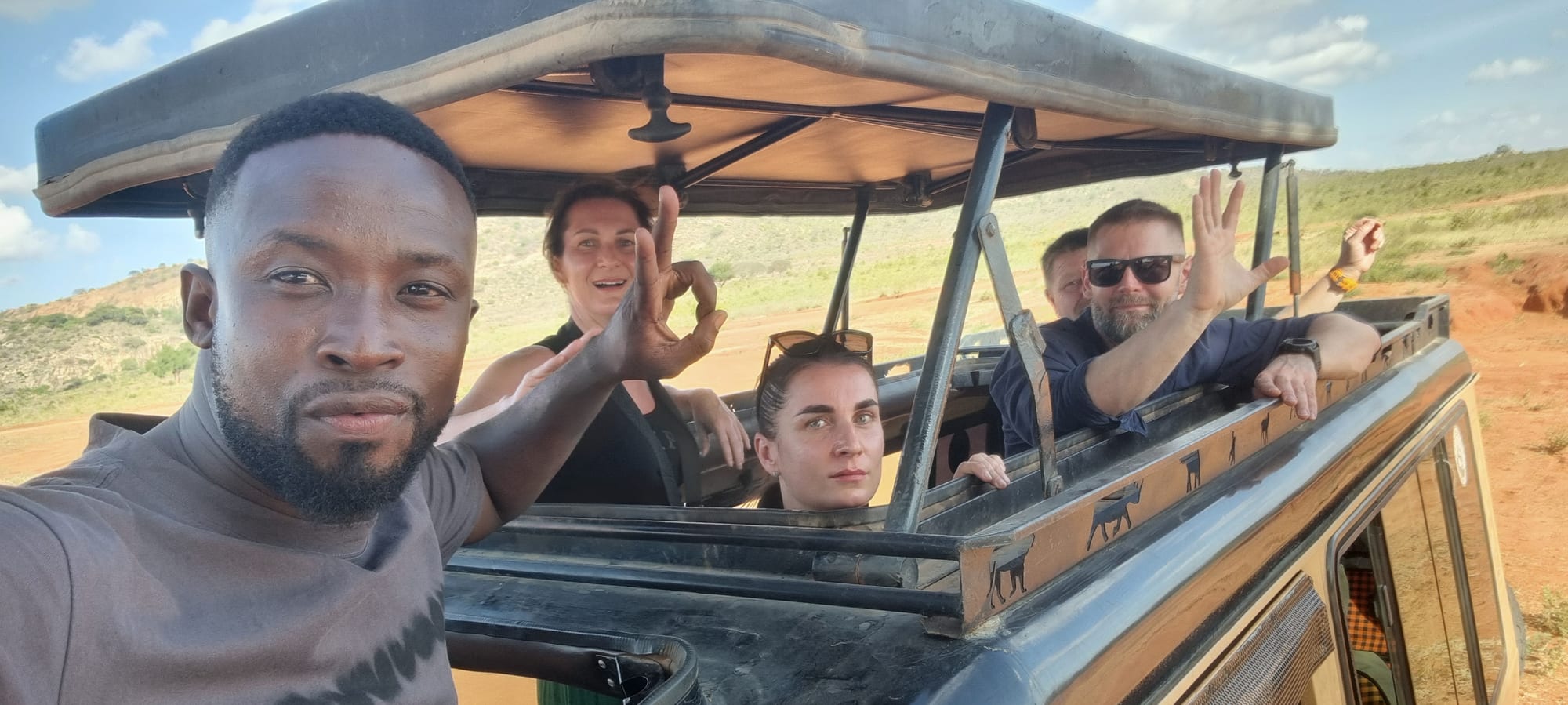 Guests and guide in the safari vehicle