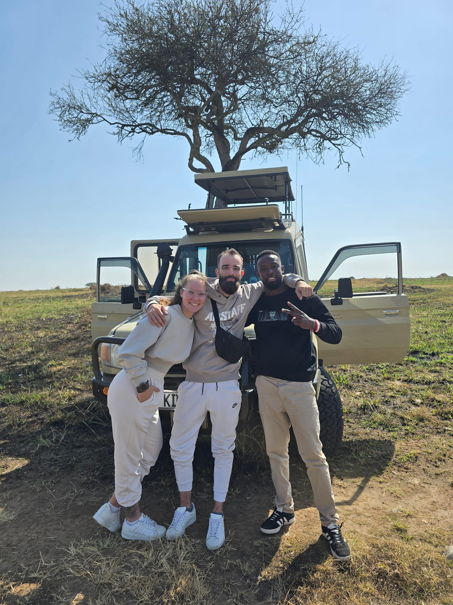 Guests by the safari vehicle